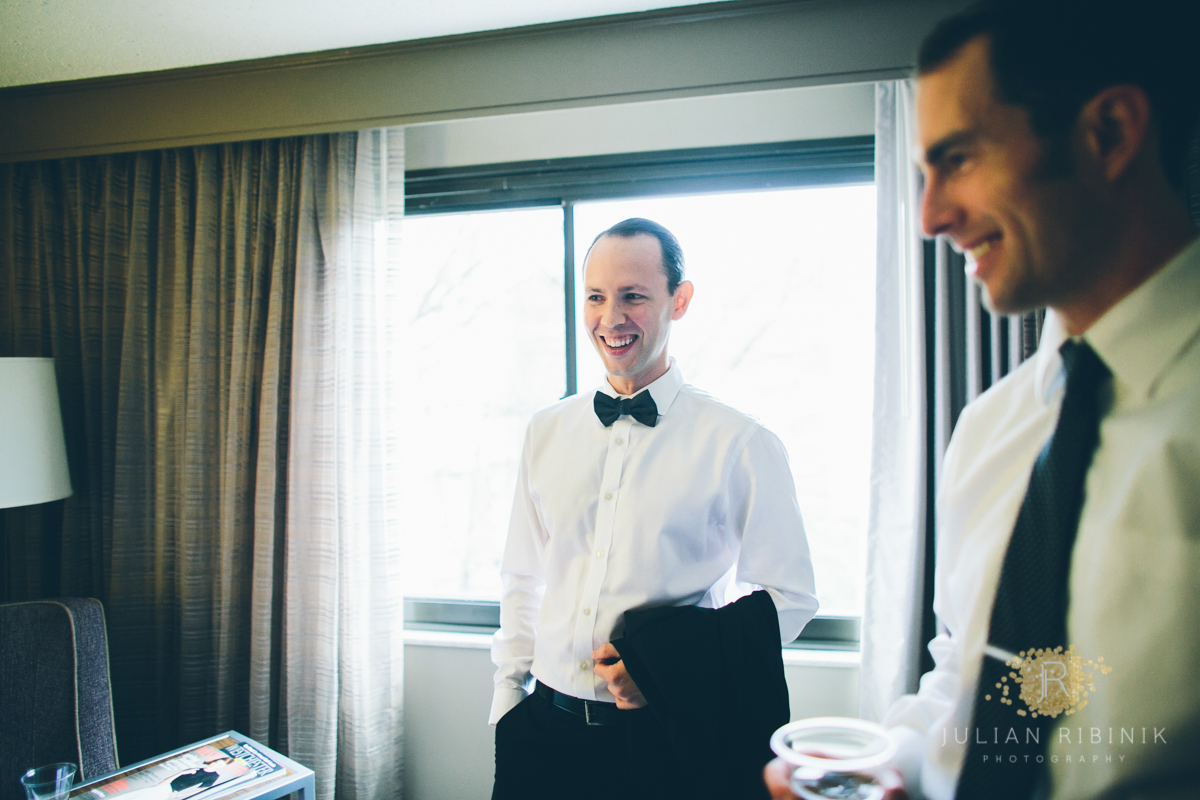 The groom has a light moment with friends