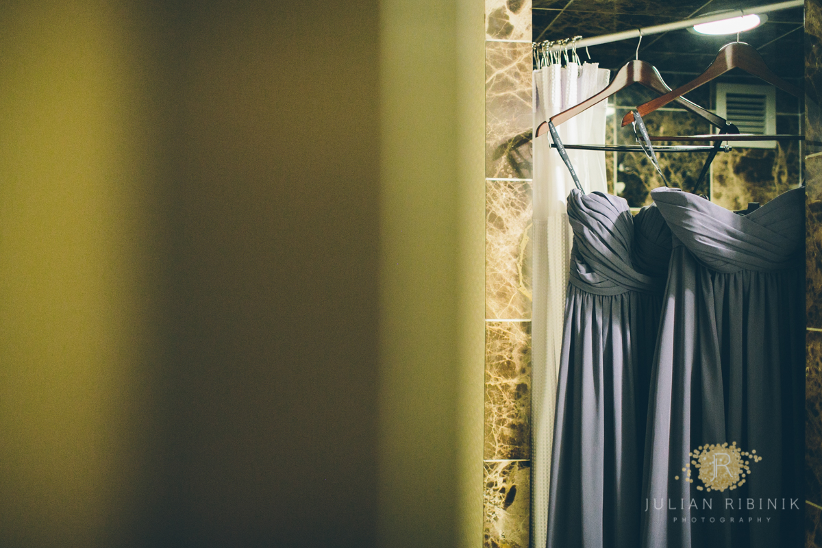 Bridesmaid dresses hanging in a hotel room