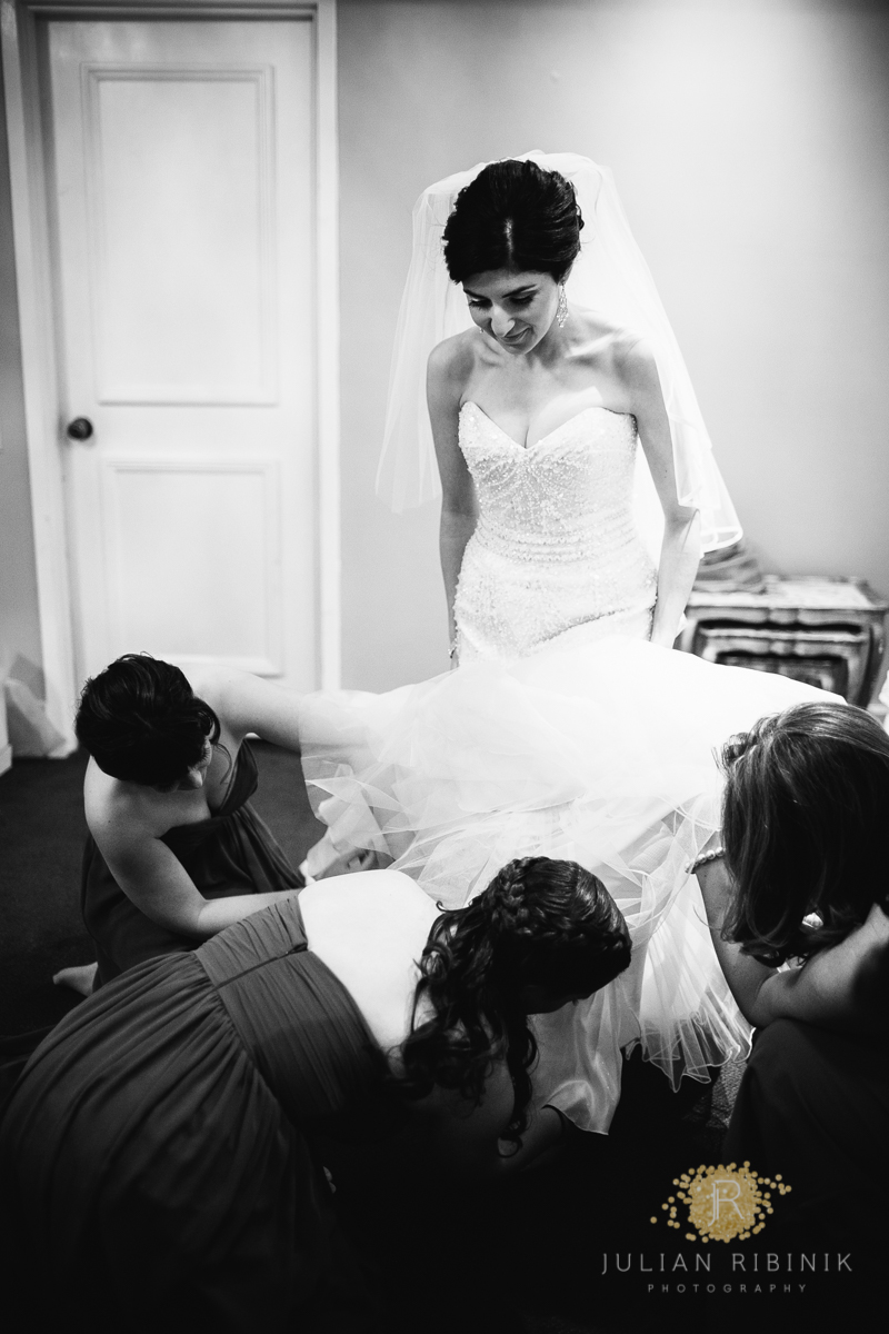 A black and white photo bride with bridesmaids
