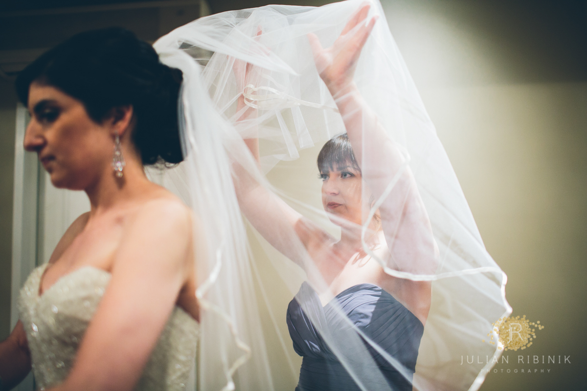 Bride gets her veil done