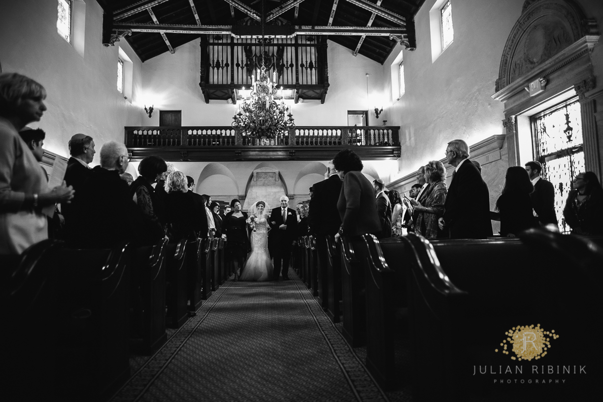 A black and white shot of Jewish wedding ceremony