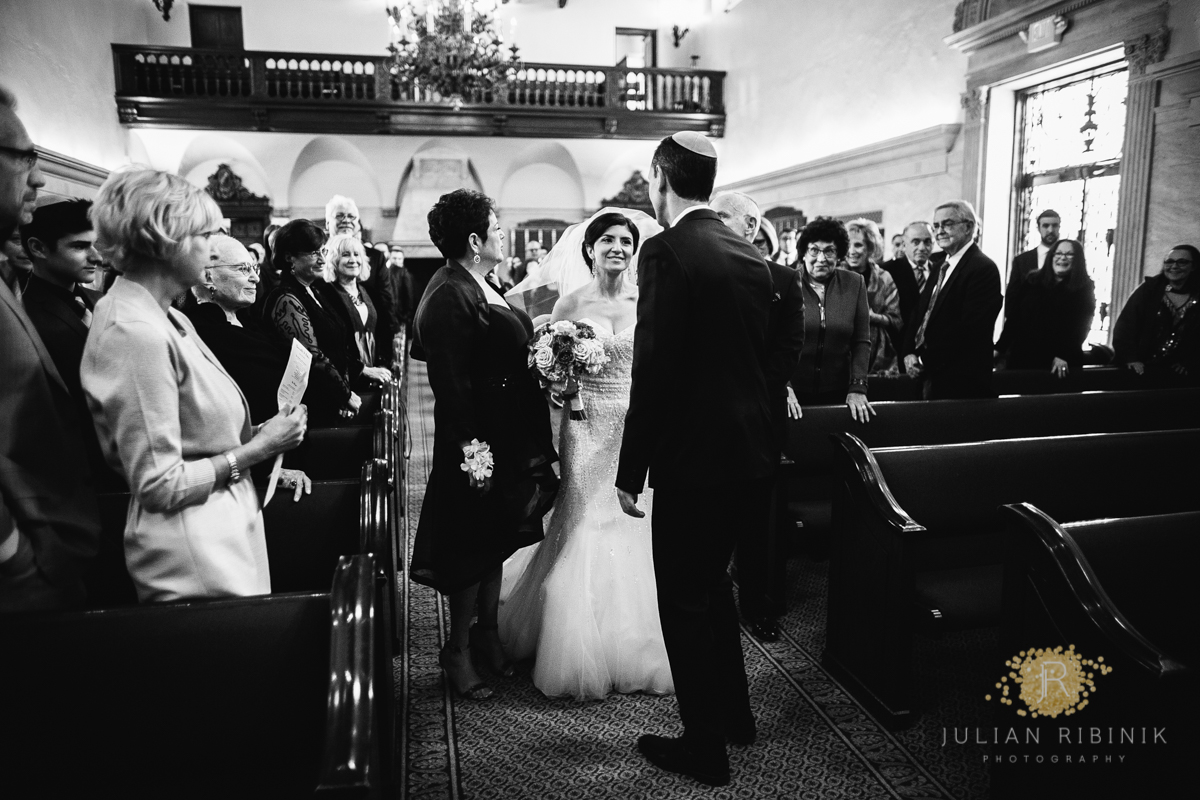 A black and white shot of Jewish wedding ceremony NY