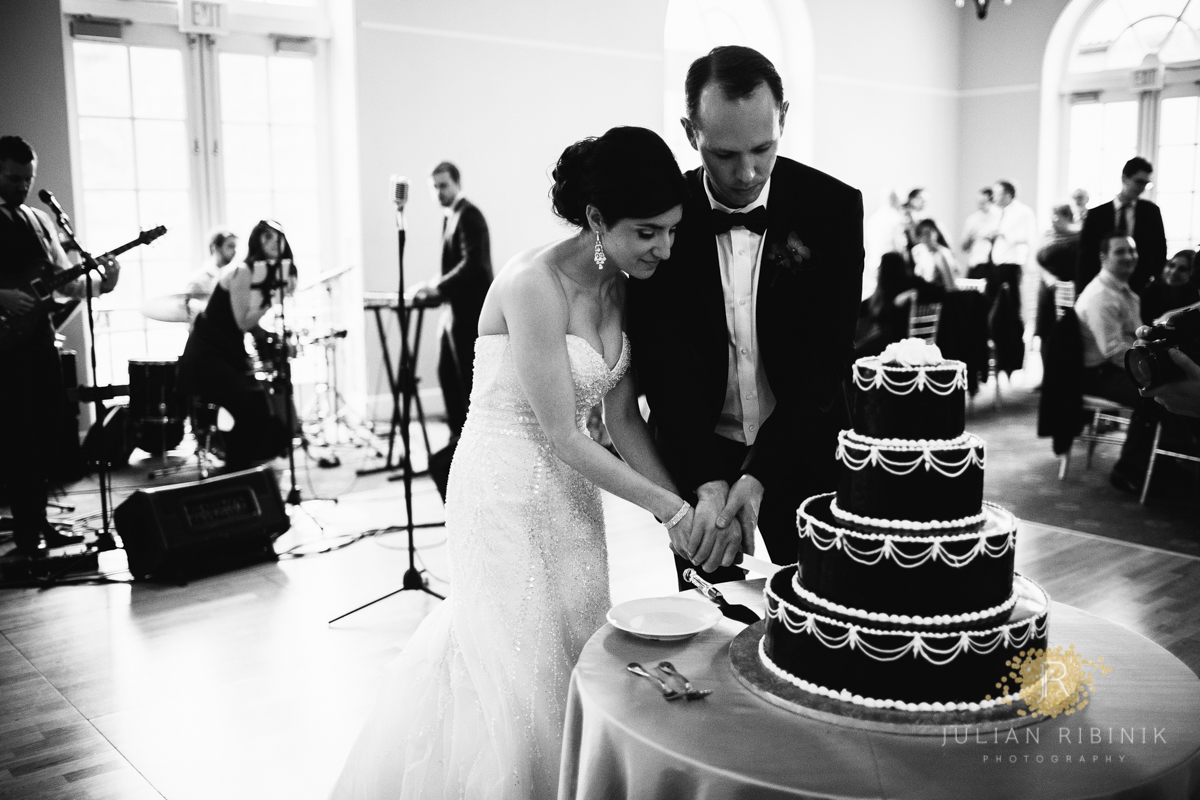 The bride and groom cut the cake