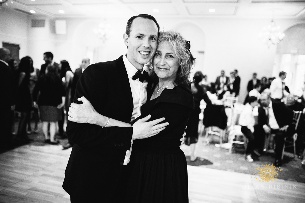 A black and white shot of groom and his mother