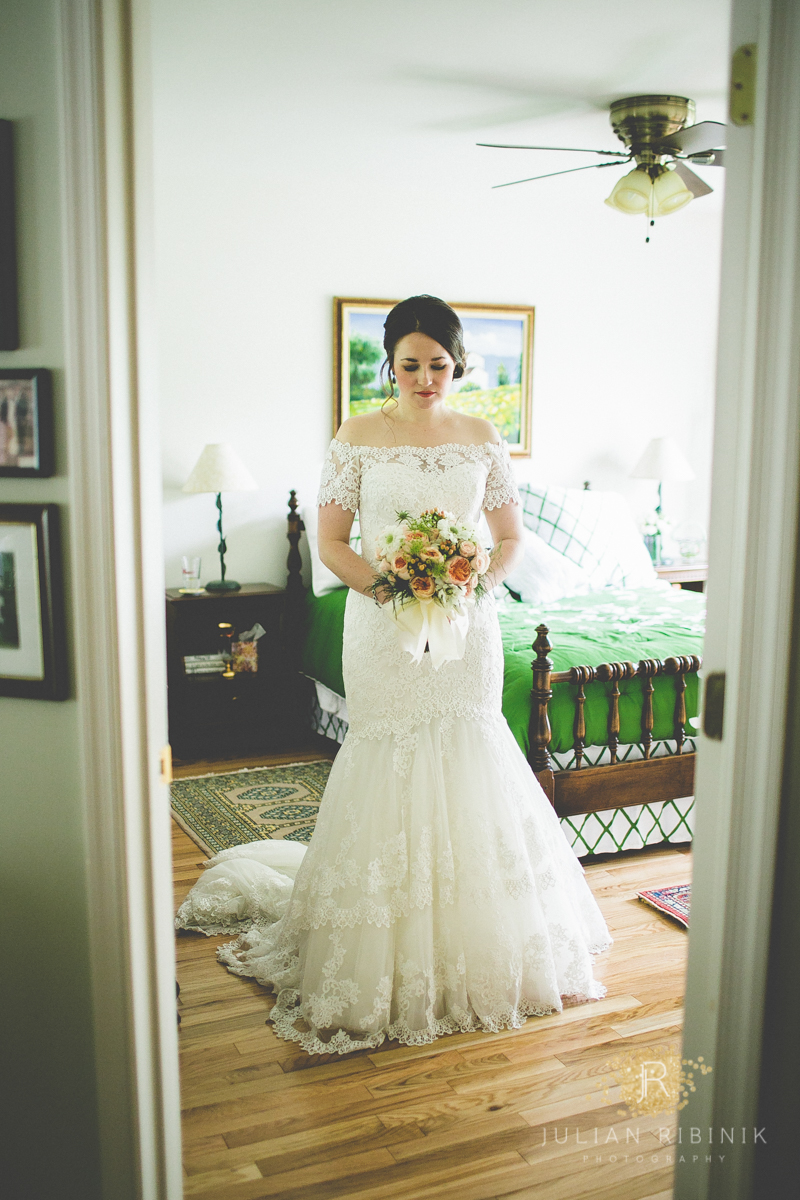Bride posing in white bridal gown