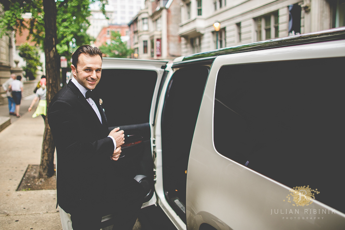 The groom smiling and entering the car for going to the wedding
