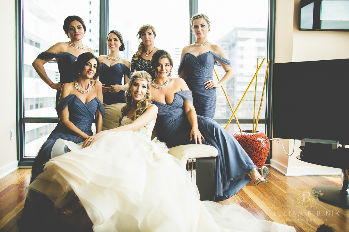 Bride with bridesmaids posing for a photo