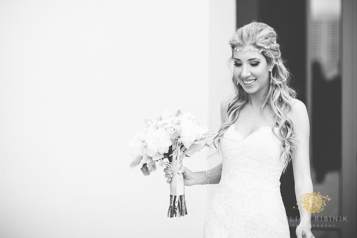 Elegant bride smilingly walks towards the wedding venue