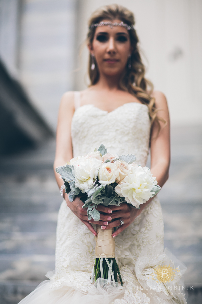 The bride holds her lovely wedding bouquet