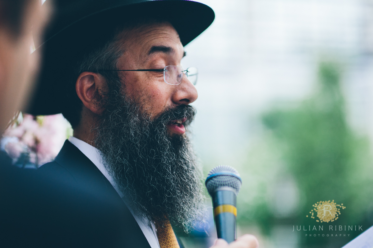 Jewish priest reciting words at a wedding ceremony