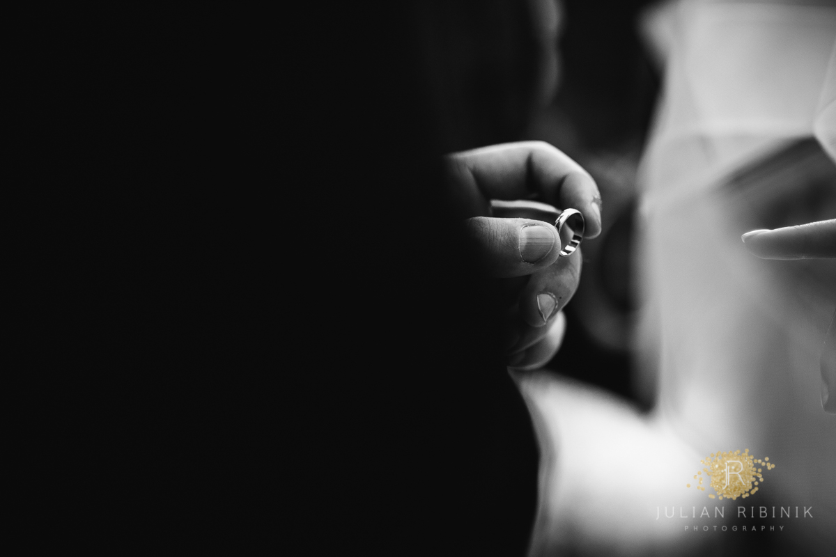 Wedding ring in the hands of groom