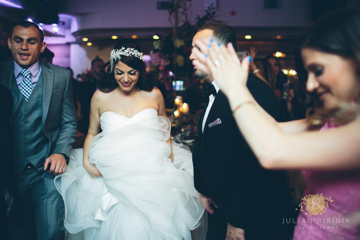 Bride dancing along with her friends 