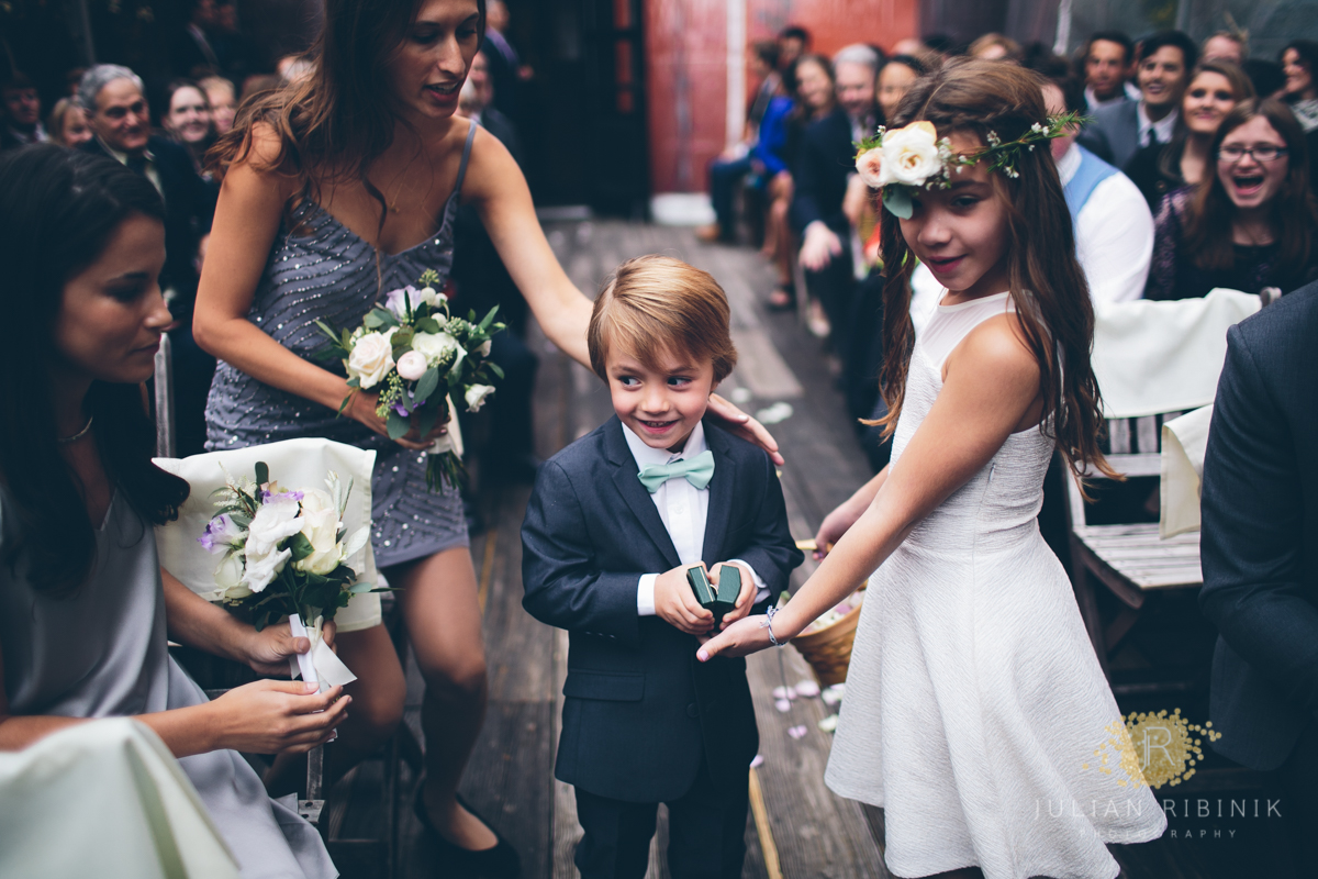 The flower girls with a handsome young boy