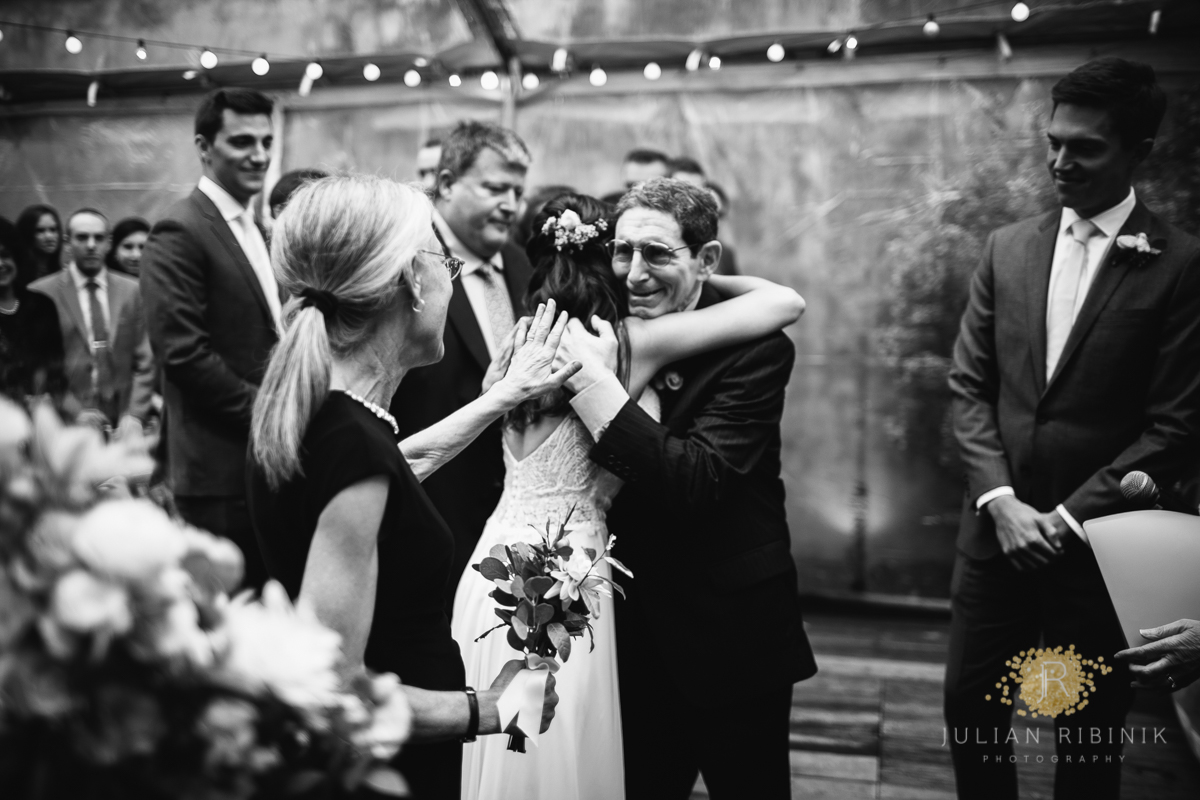 A black and white photo of an emotional moment at the reception