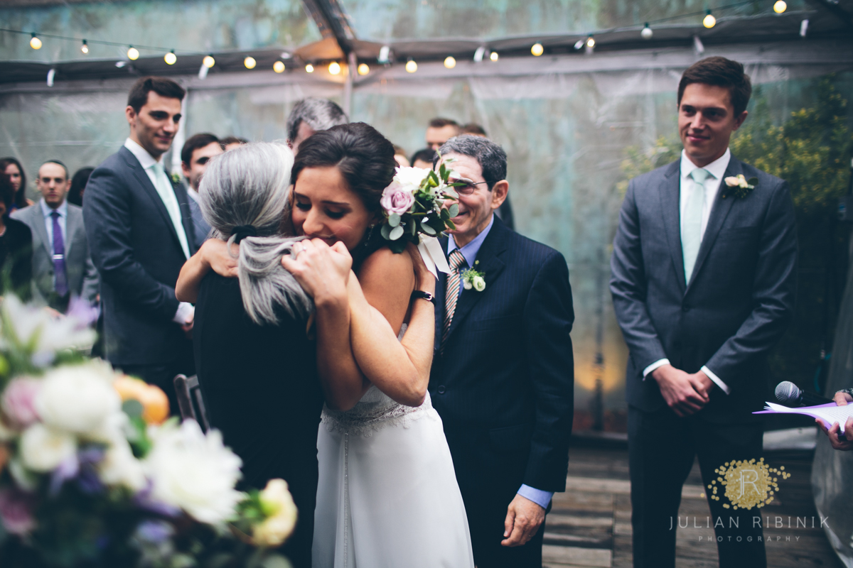 The bride tightly hugs her grandmother 