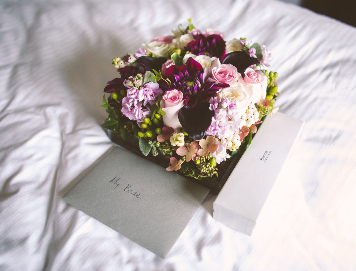 A bridal bouquet with a groom's letter to the bride