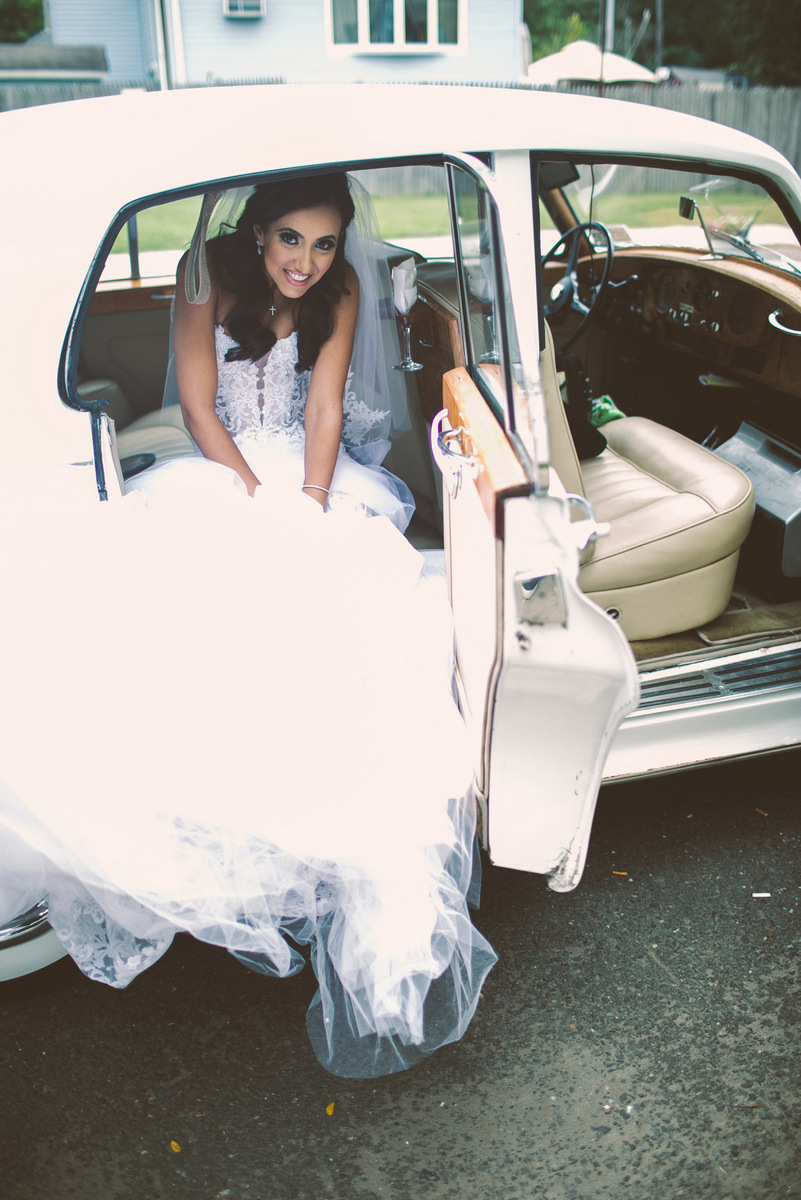 The bride arrives in a classic car