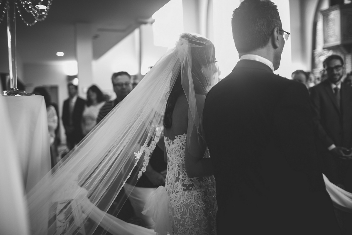 The bride walking down the aisle with her father at her NJ Coptic wedding 