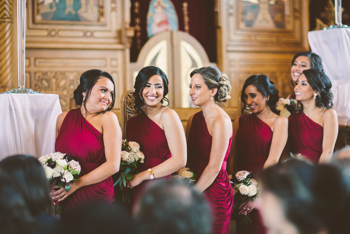 Beautiful bridesmaids dressed in red