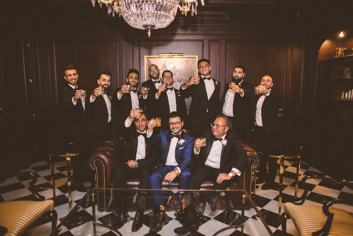 The groom toasts with his groomsmen