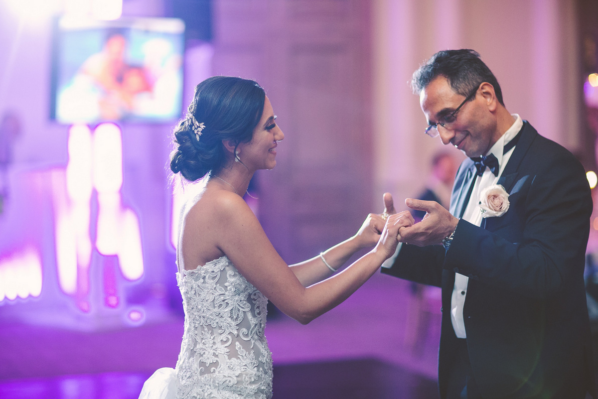 The bride and her father dance together