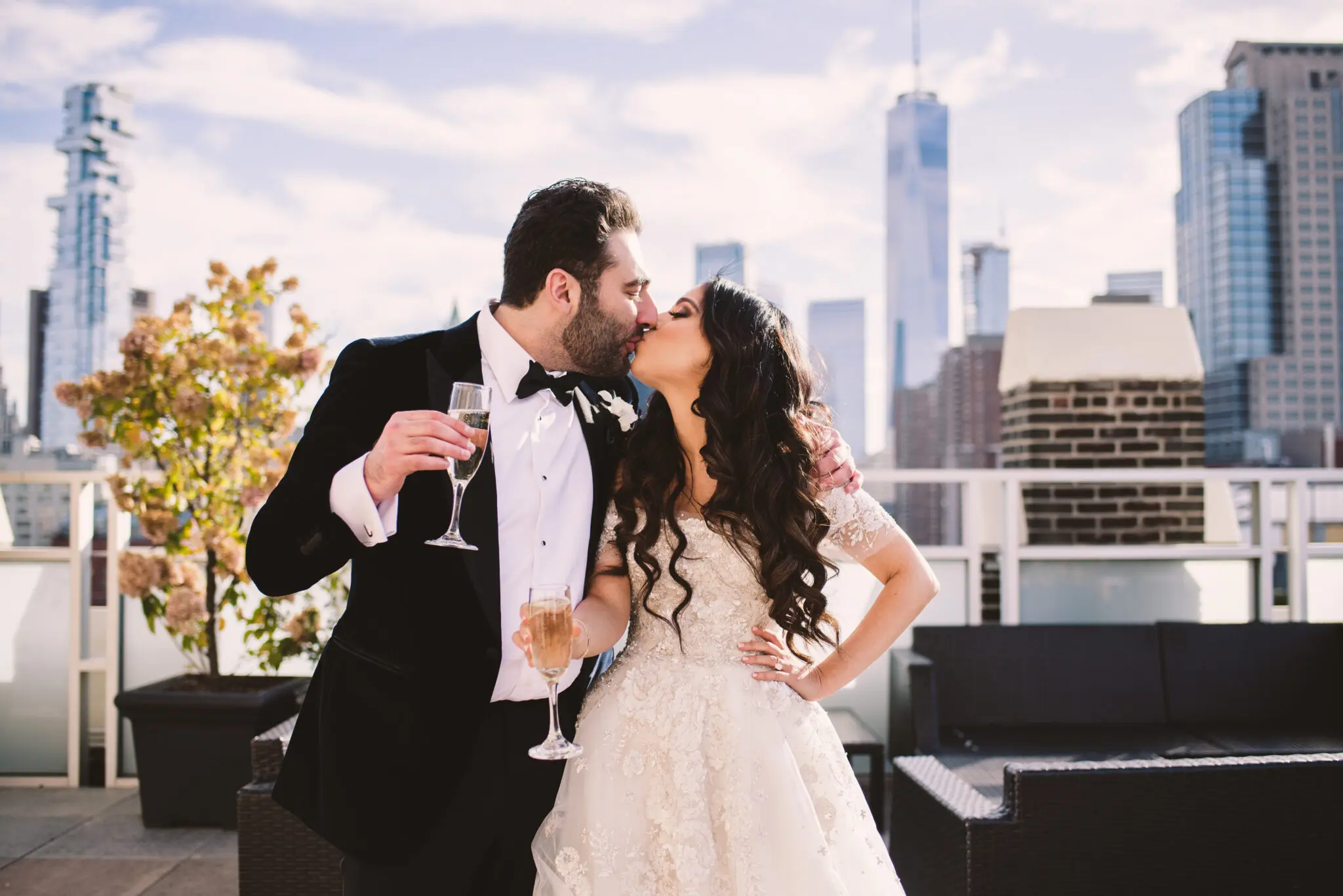 couple kissing during new york rooftop wedding