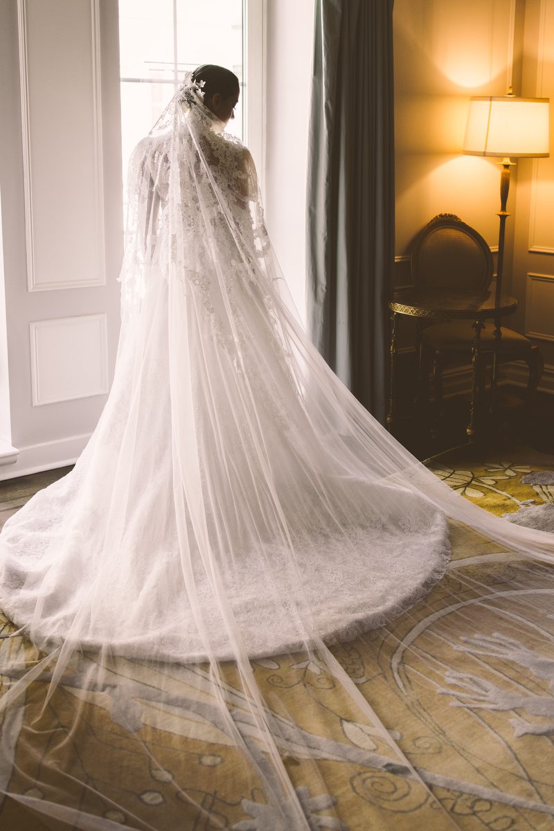 Cathedral length veil in the hotel corridor