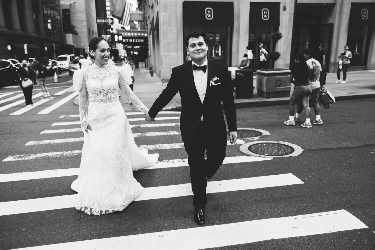Bride and groom beneath the St Regis marquee