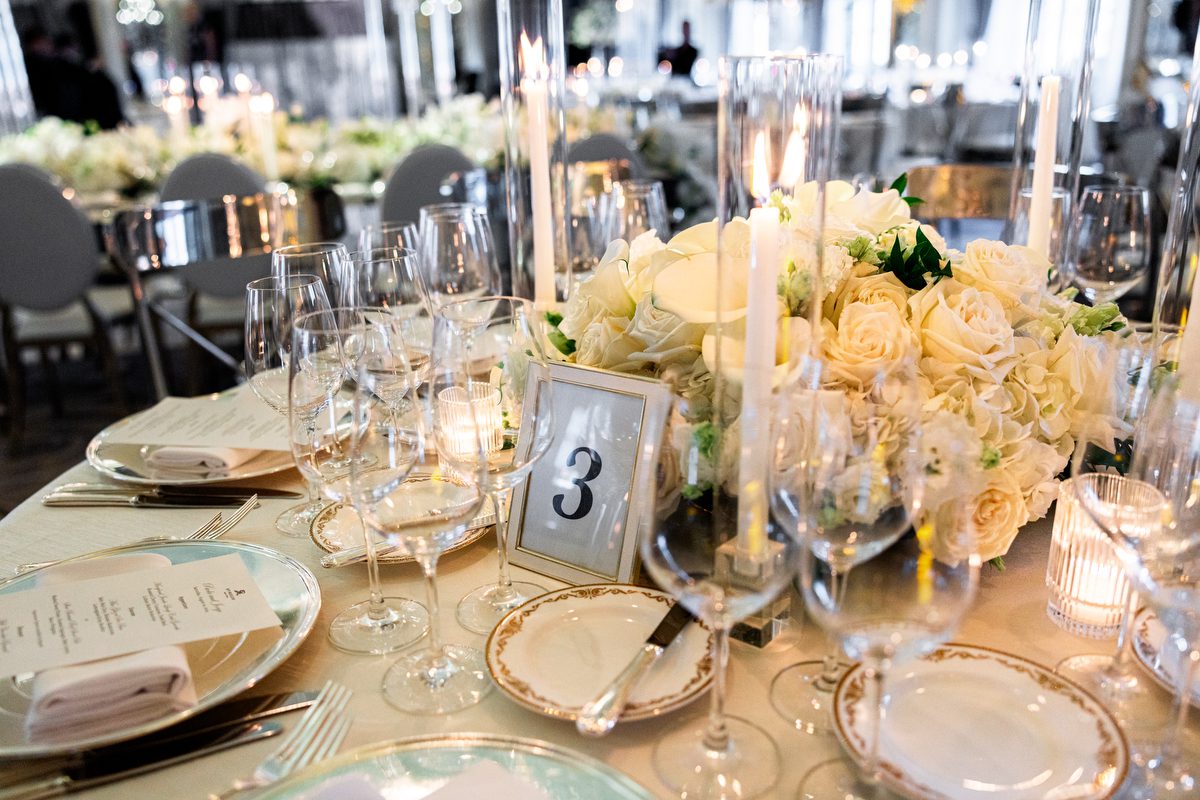 Reception table with white roses and hydrangea