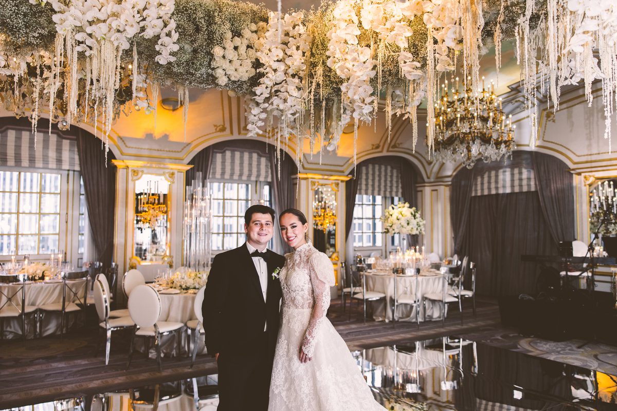 Bride and groom entering the ballroom