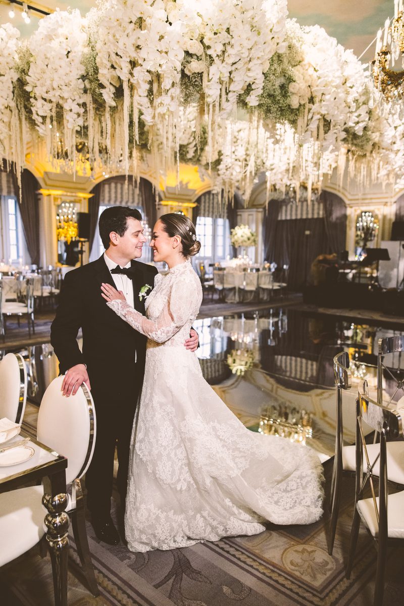 Couple dancing beneath the floral canopy