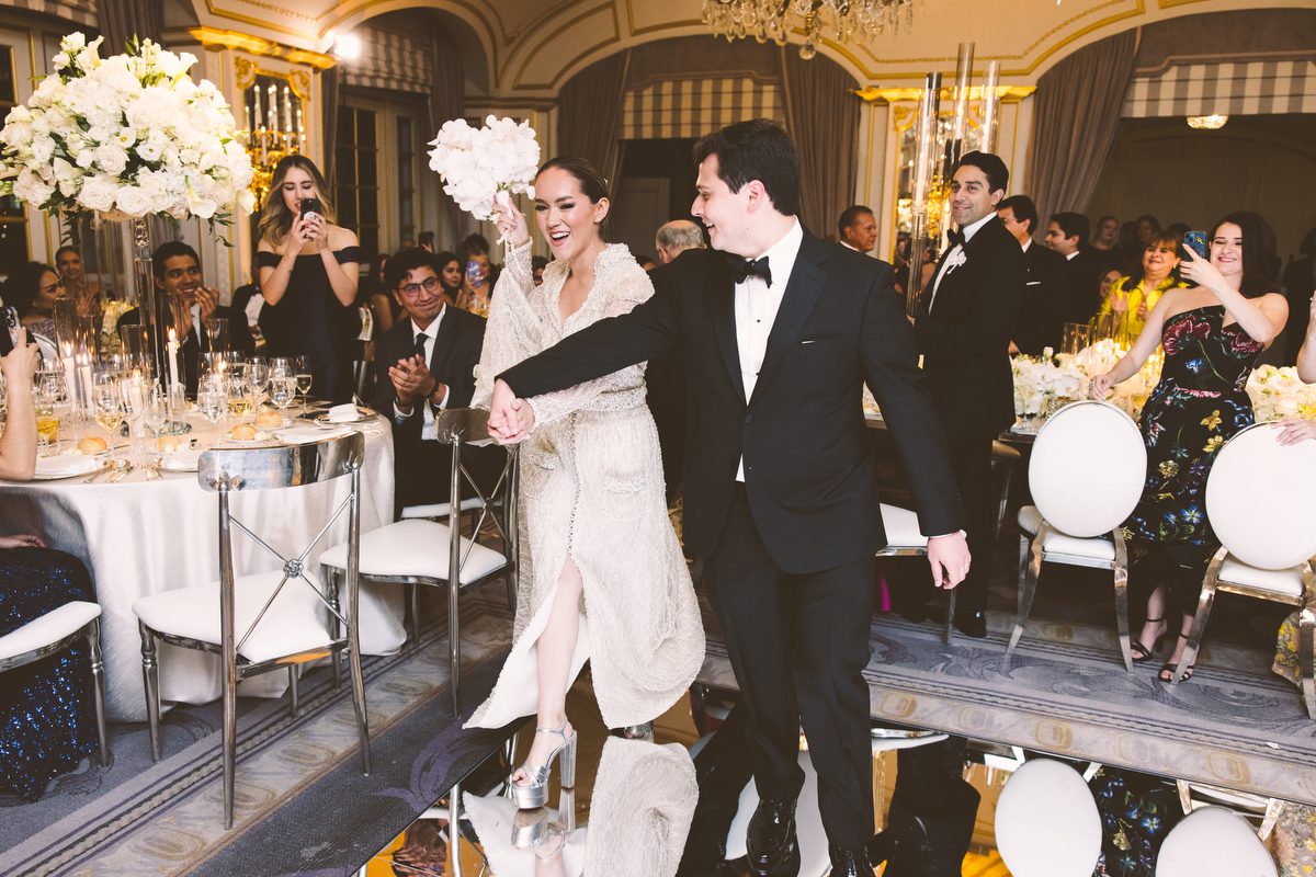 Dancing beneath the hanging florals