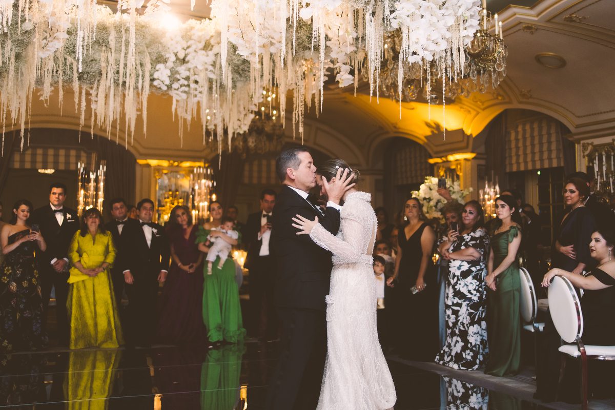 Dancing beneath the hanging florals