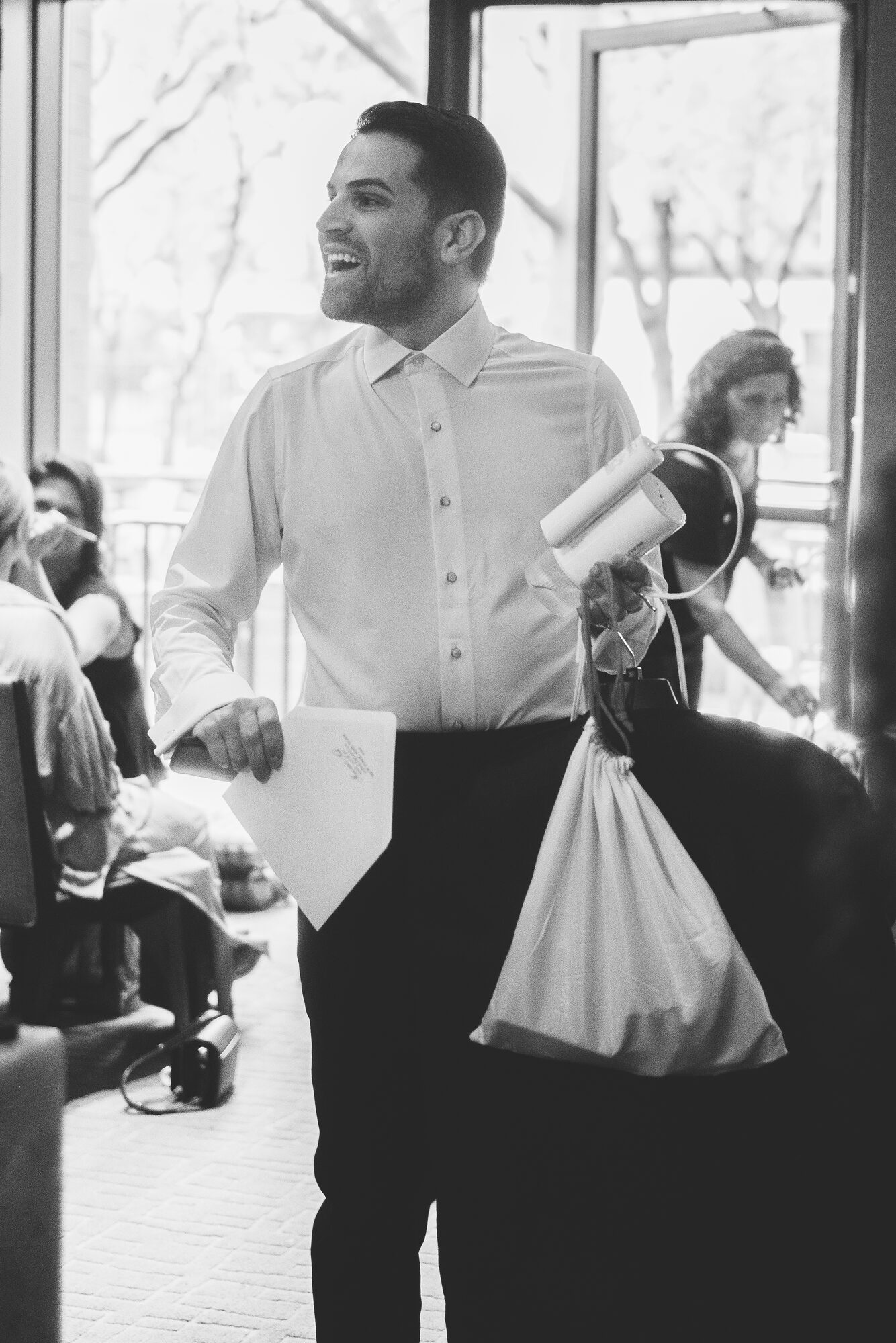 A guest carrying in bags on the morning of a New York City wedding