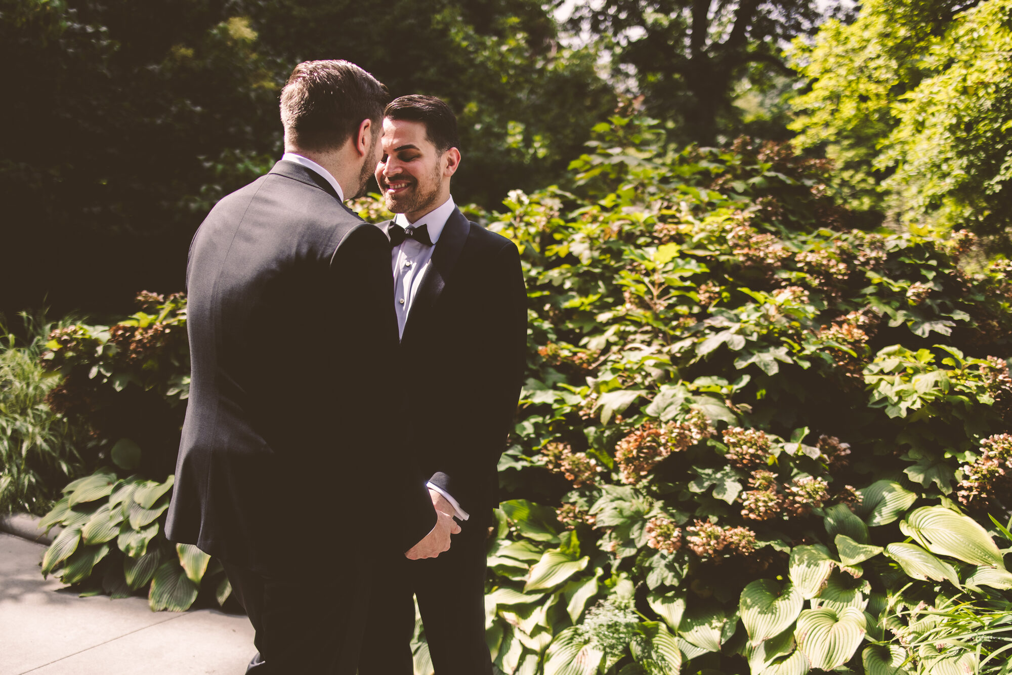 A tender portrait of two grooms before their New York City wedding reception