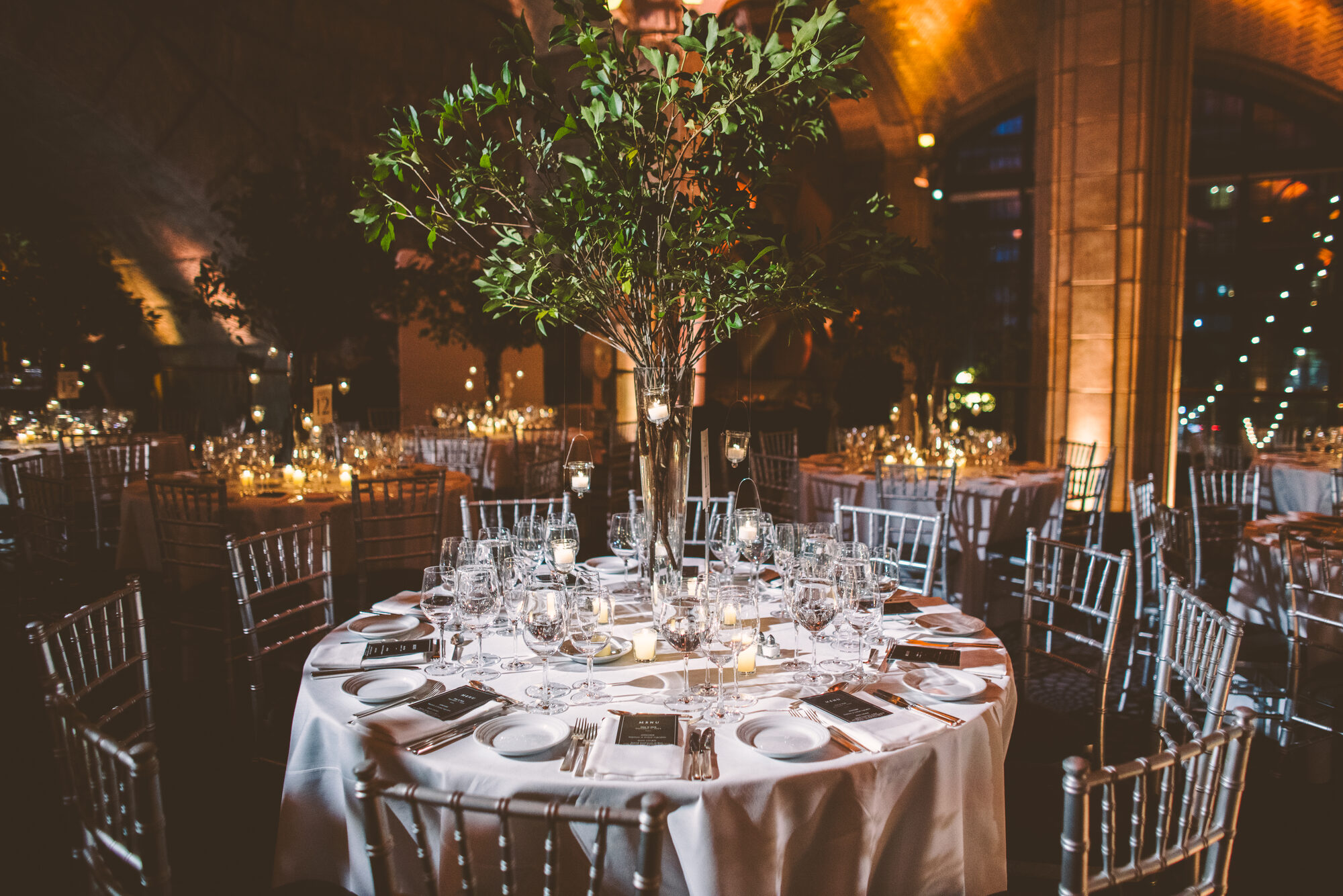 An olive tree centerpiece at a black tie Guastavino's wedding