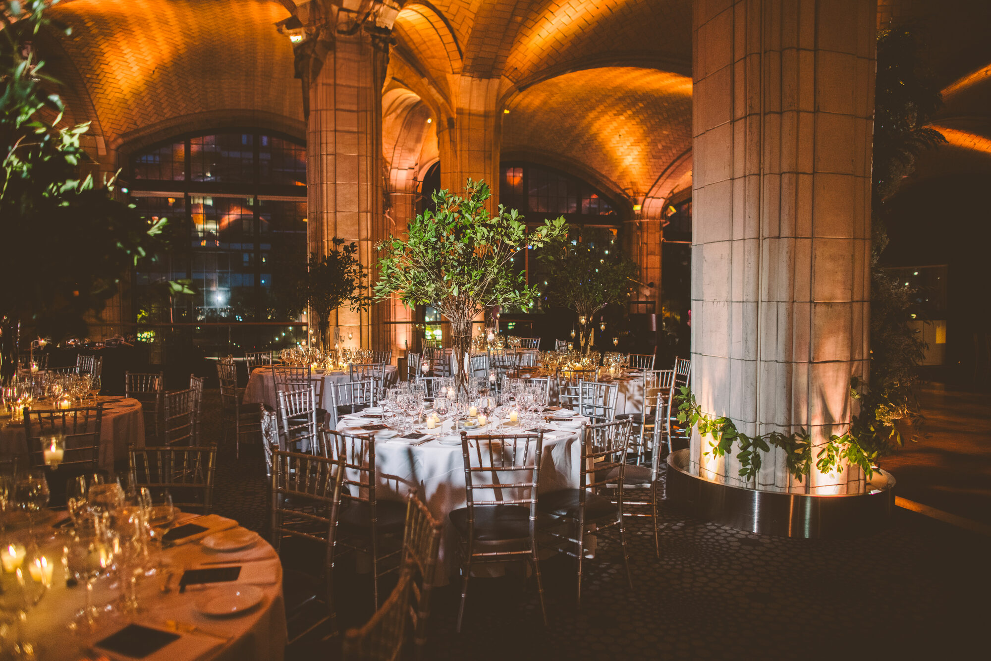 Place settings and candlelight at a New York City wedding reception