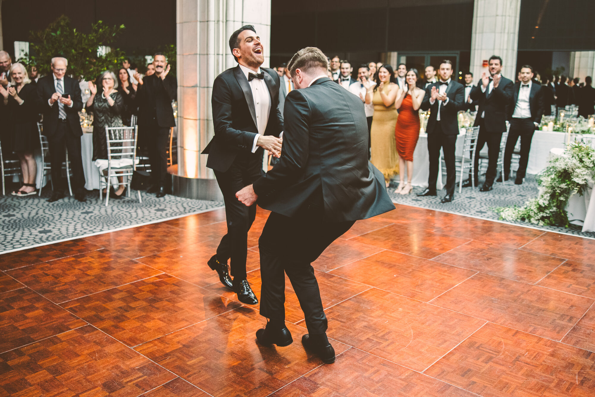 Two grooms dancing together at their Guastavino's wedding