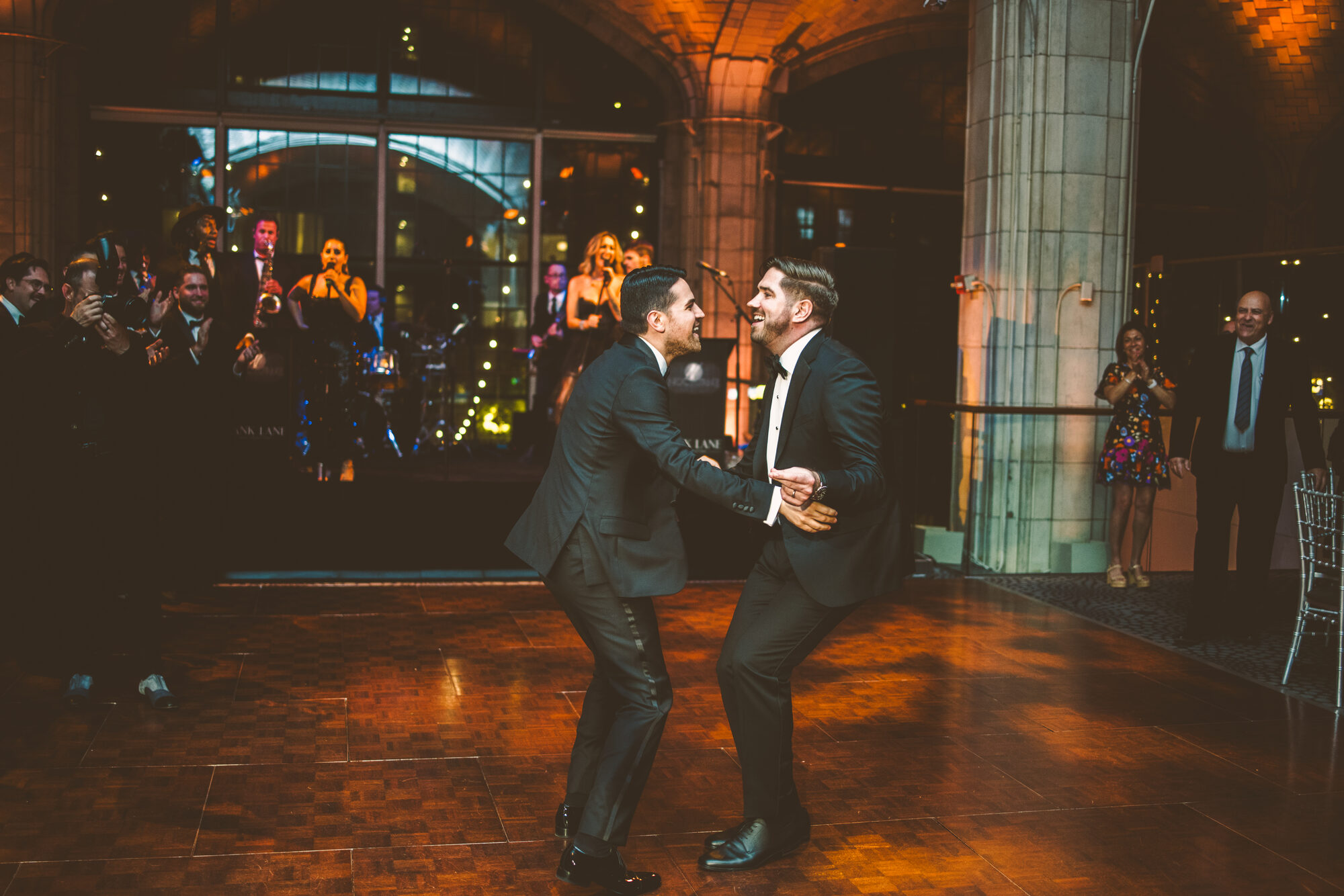 The couple dancing with their wedding party at Guastavino's