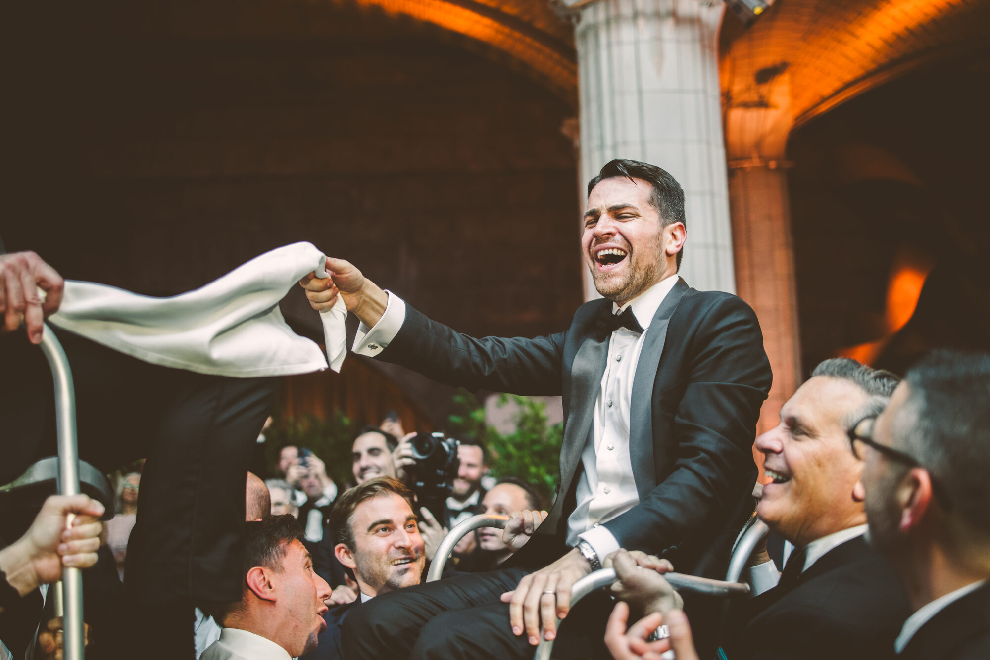 A groom lifted on a chair during the hora at Guastavino's