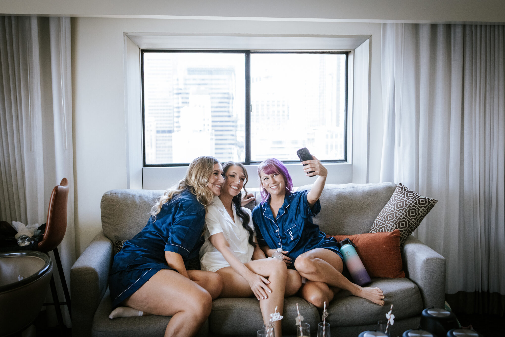 Bridesmaids in matching robes before a Guastavino's wedding
