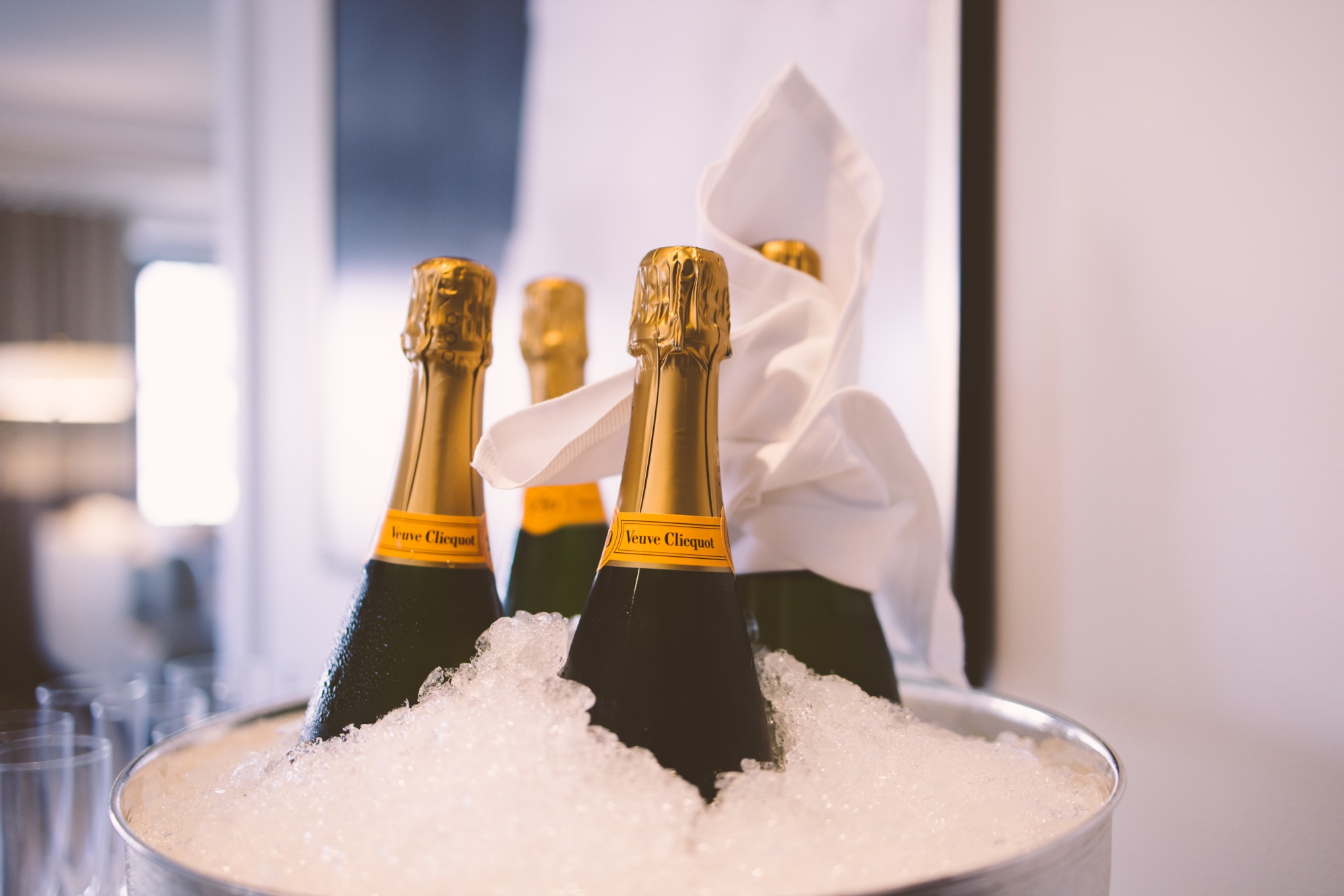 Champagne bottles chilling in a silver ice bucket before the ceremony