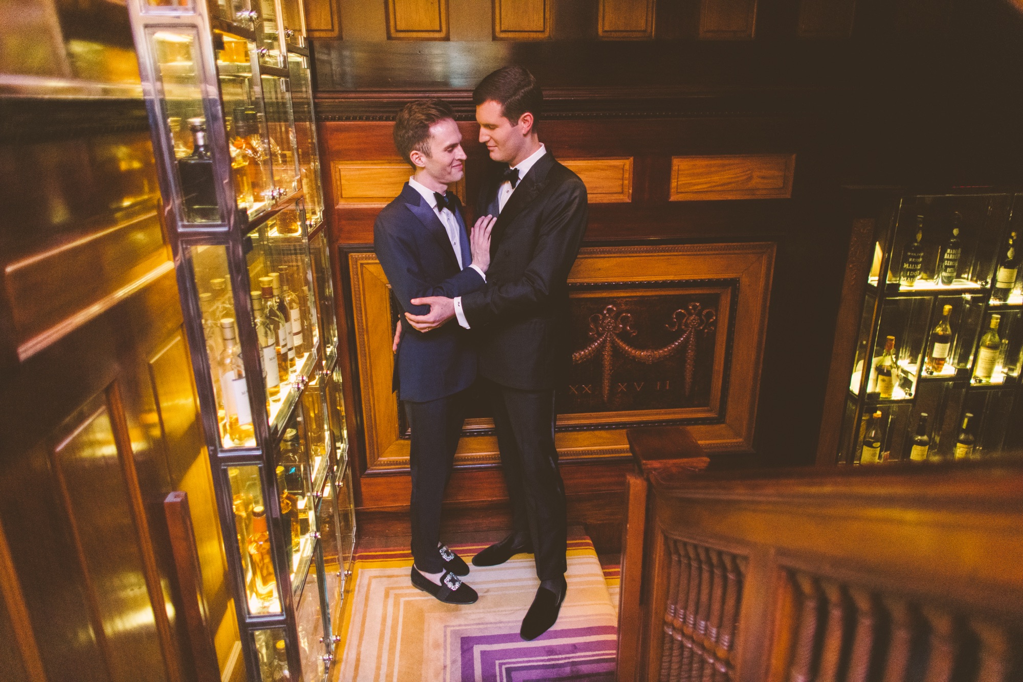 A couple on the staircase above the bar in the Villard Mansion