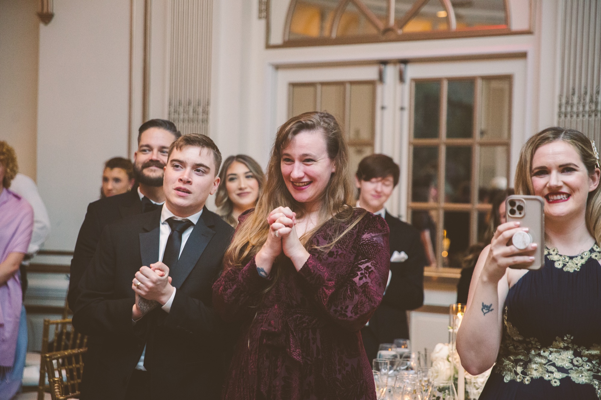 Guests raising a toast during dinner in the ballroom