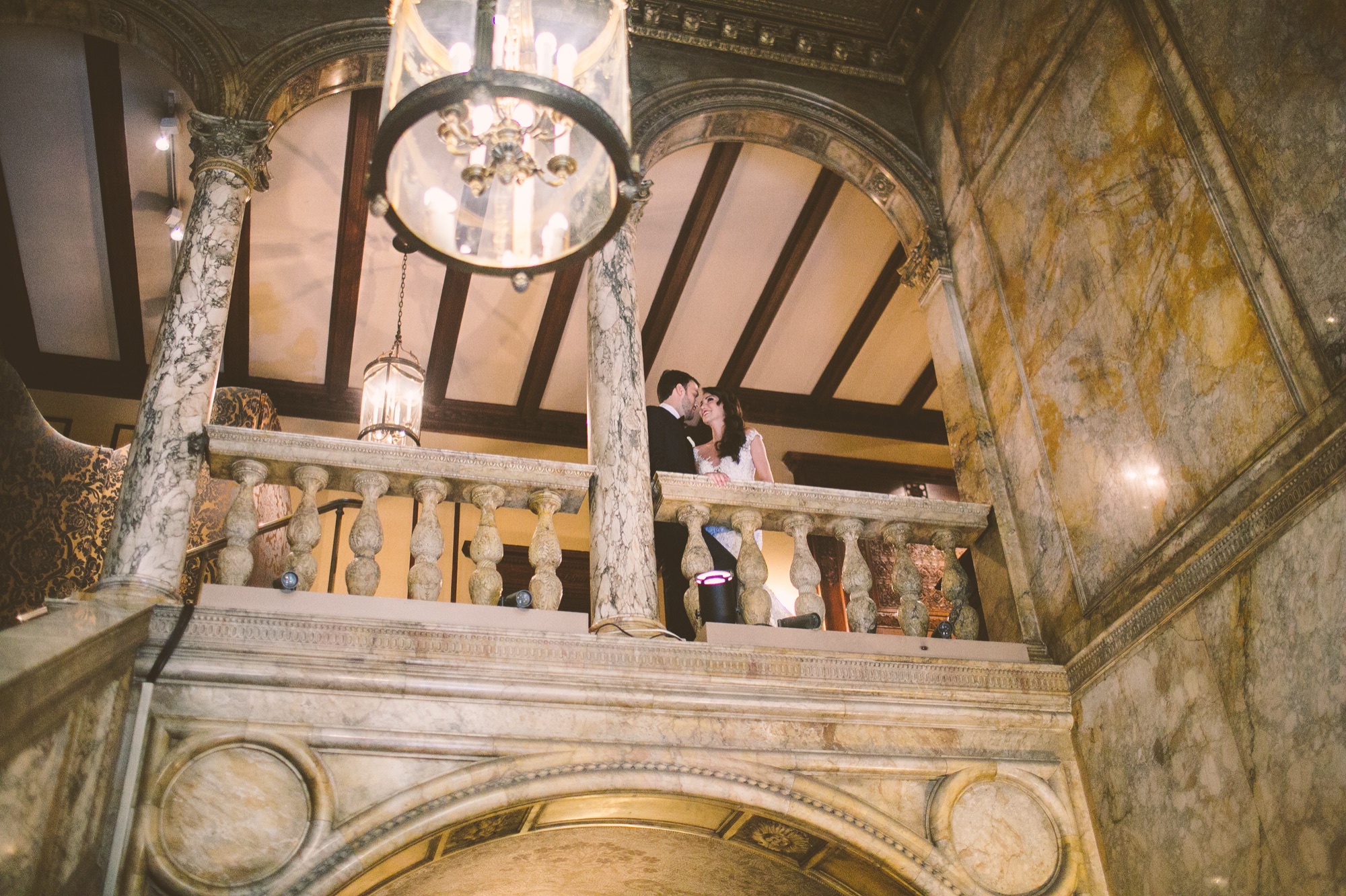 The coffered ceiling and chandelier above the Villard Mansion stair hall