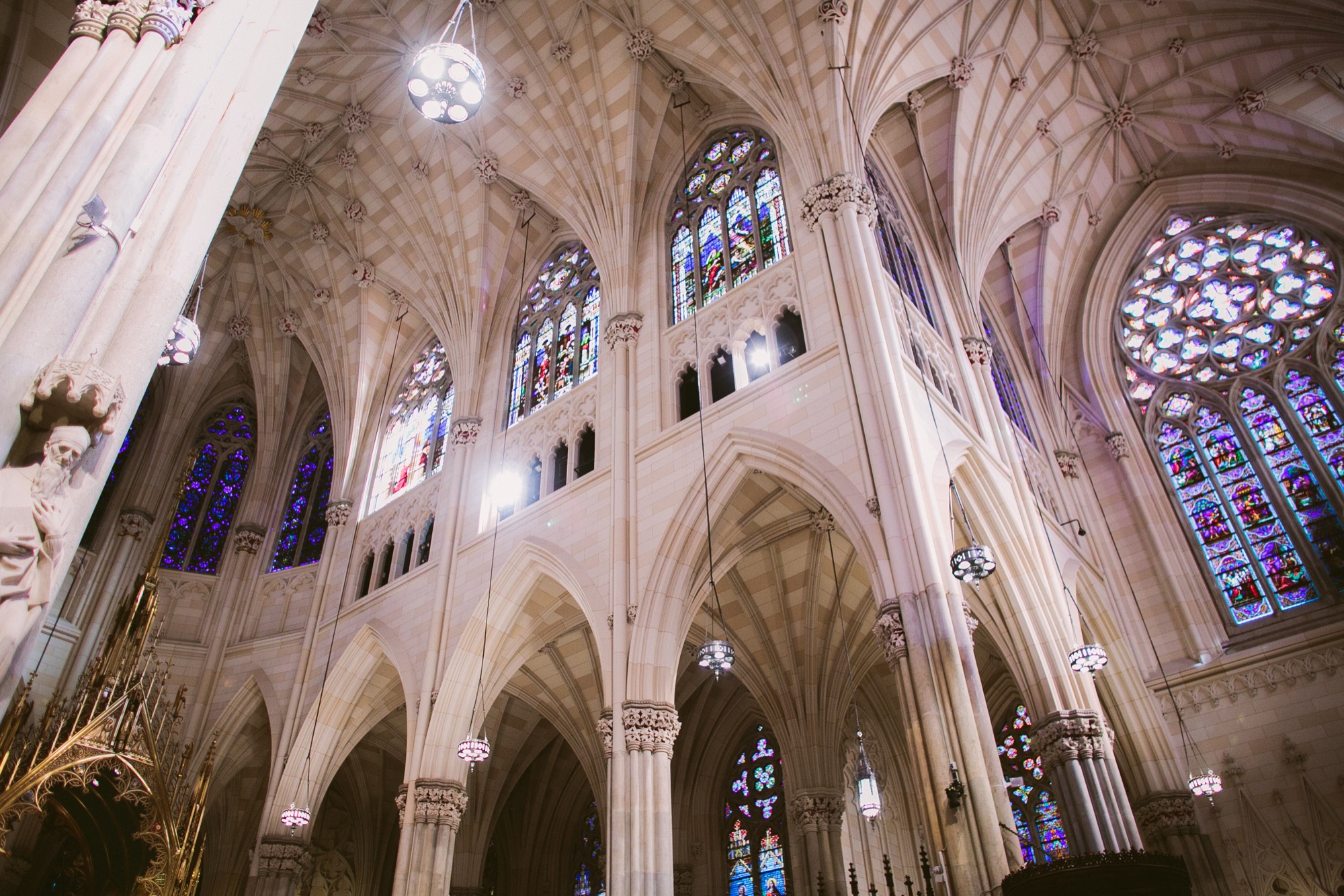 The vaulted Gothic ceiling and stained glass of St. Patrick's Cathedral