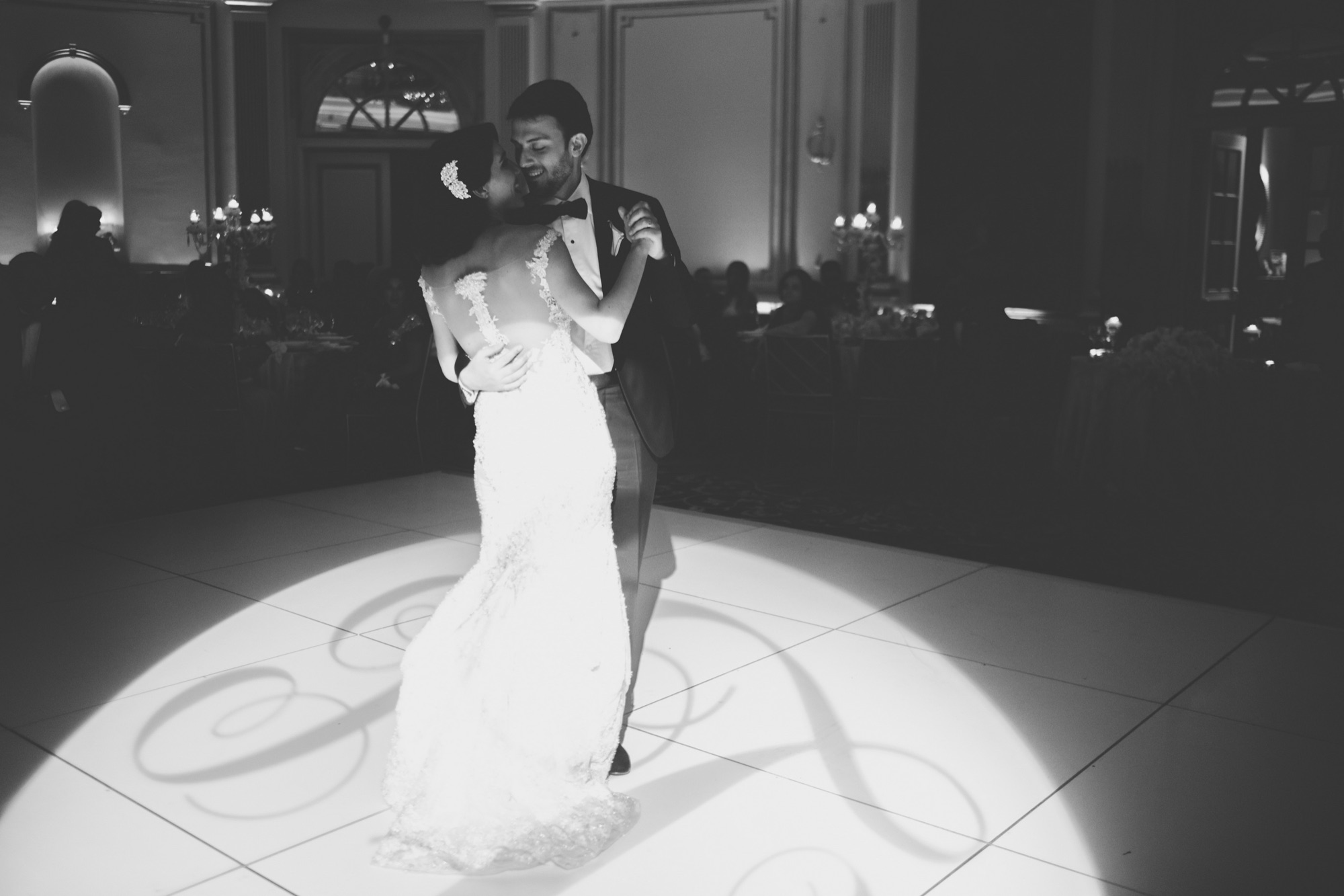 Black and white photograph of a dance on the monogrammed floor
