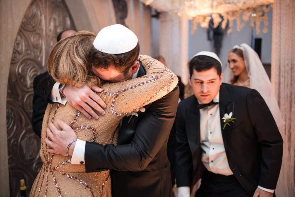 The groom embracing his mother in the seconds after the ceremony ends
