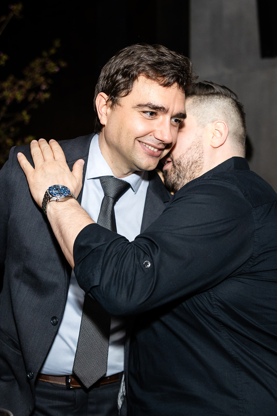Friends greeting each other at an Aman New York reception