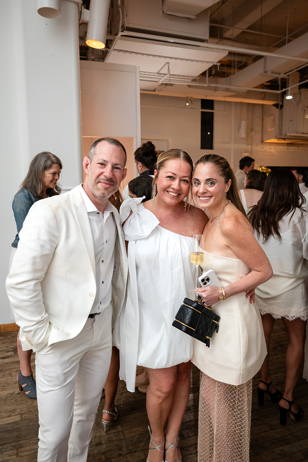 Guests dressed in white at West Edge NYC cocktail reception